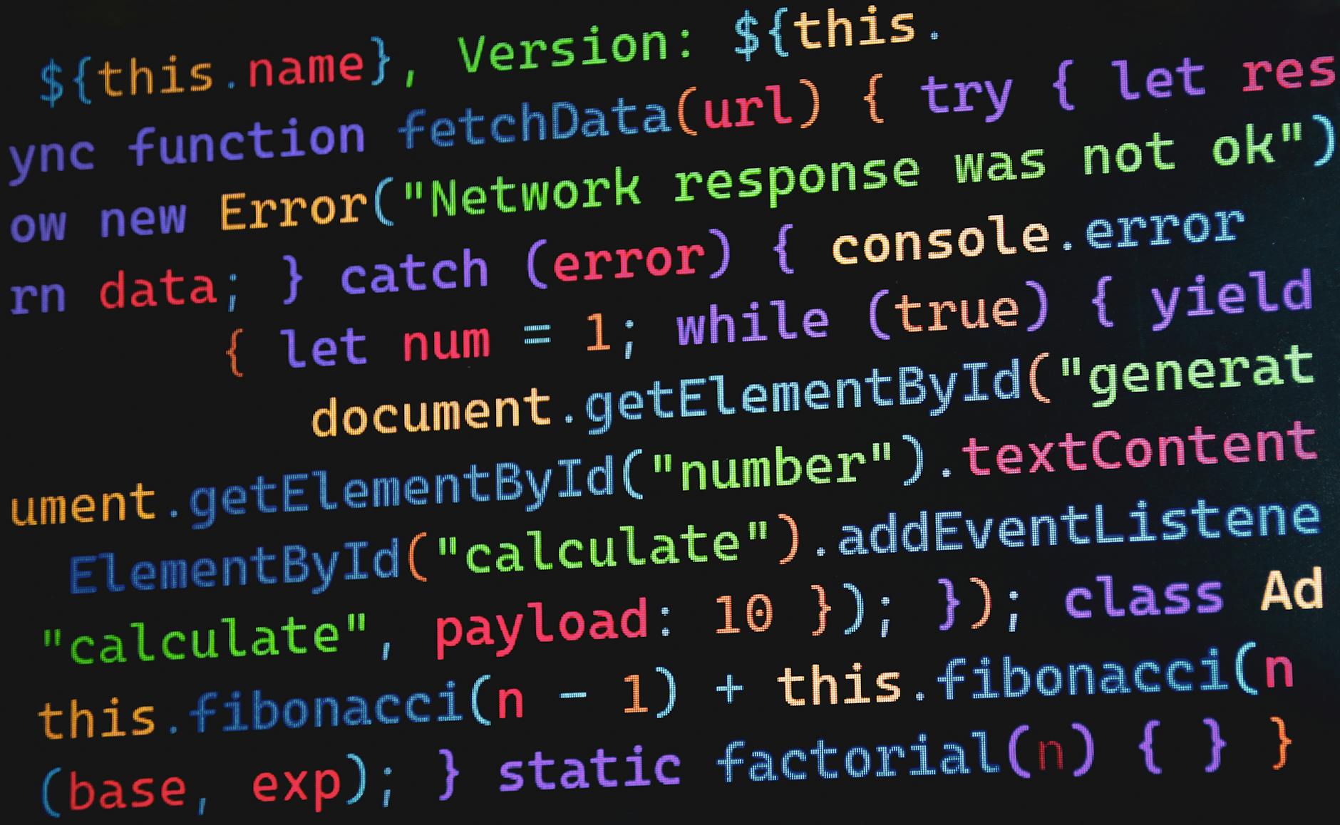 Kolorowy kod JavaScript na monitorze przedstawiający koncepcje programowania