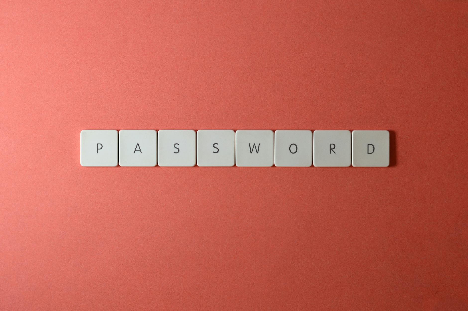 Białe klawisze z napisem PASSWORD na koralowym tle